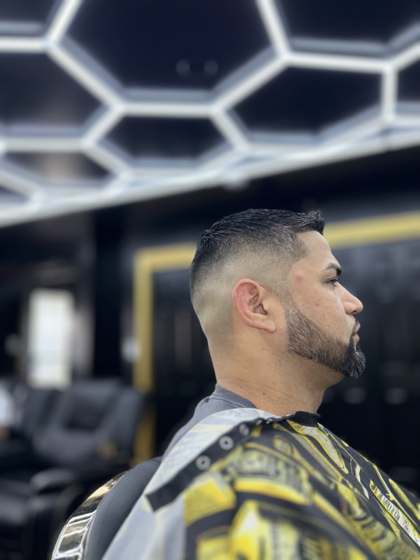 Low fade with beard shape